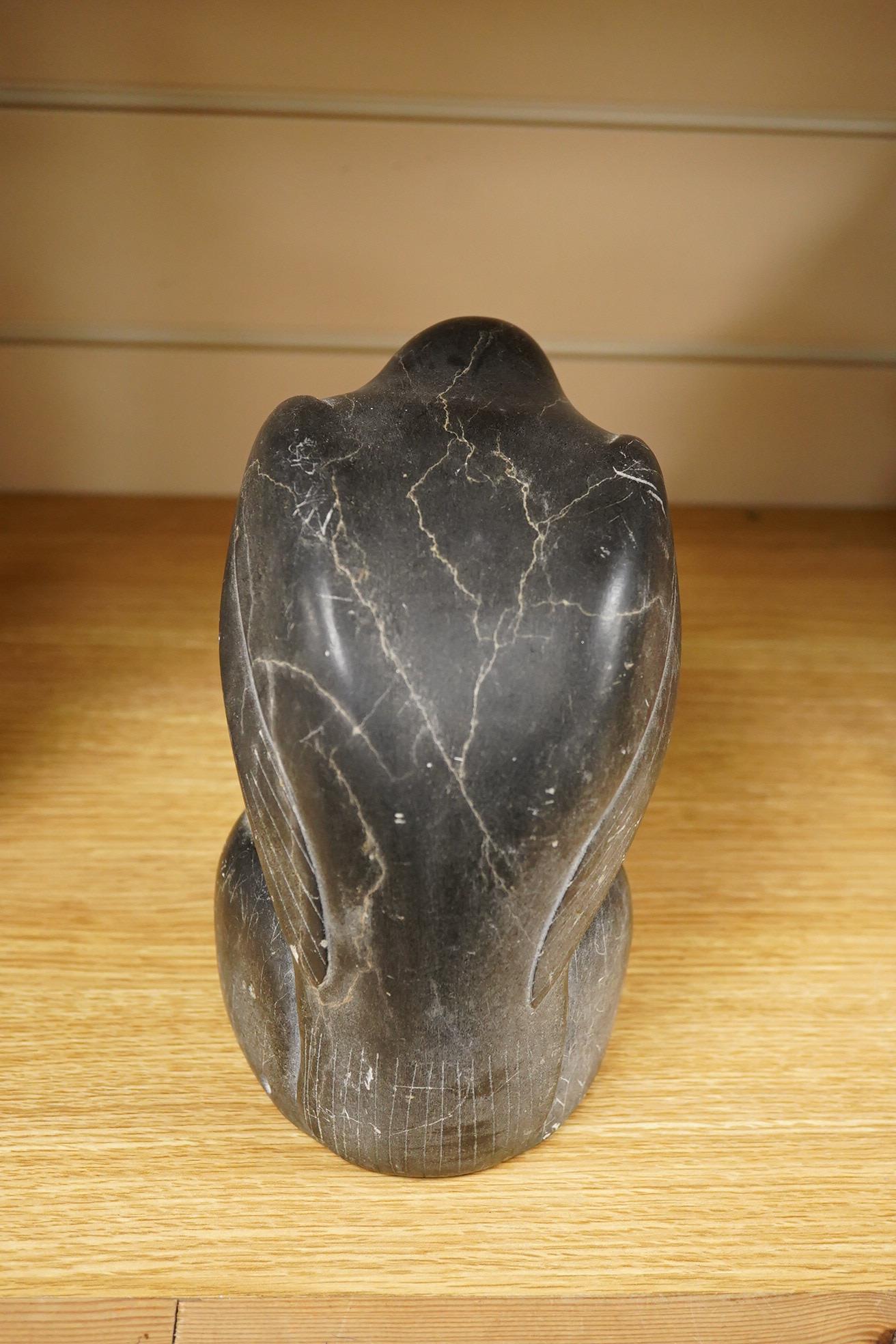 An Inuit stone carving of a falcon by Isapik, 18cm high
